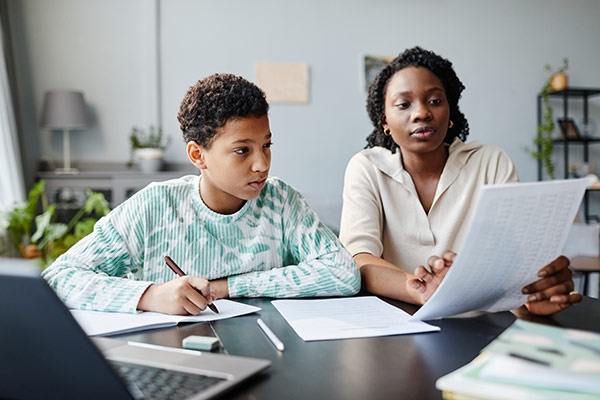 Parent working with student on homework