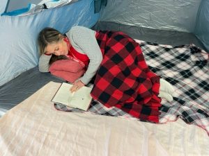 Stacy_reading_in_tent