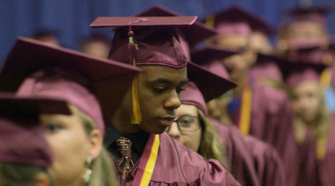 St. Johns County School District students in line during a graduation ceremony.