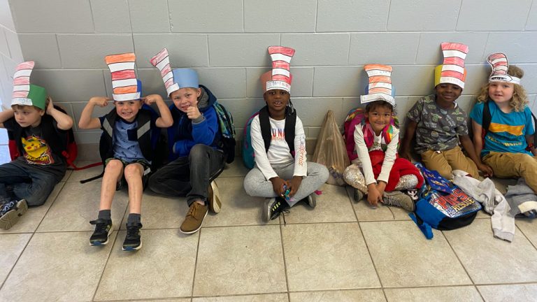 Students wearing striped hats