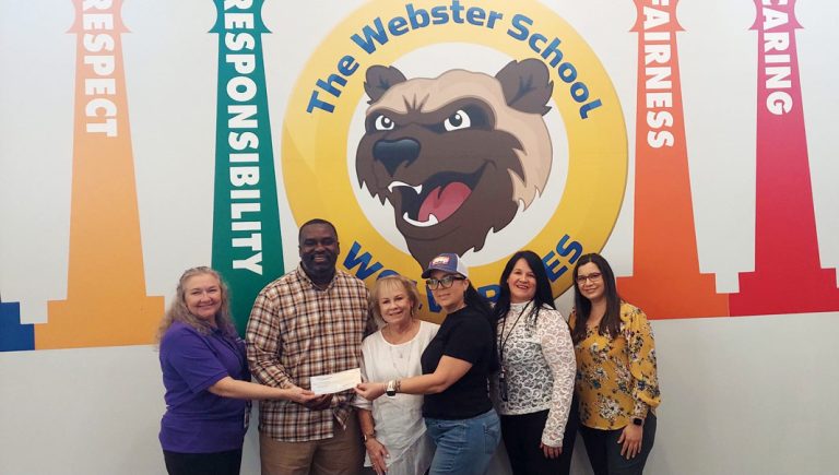 Webster Elementary School representatives receiving check