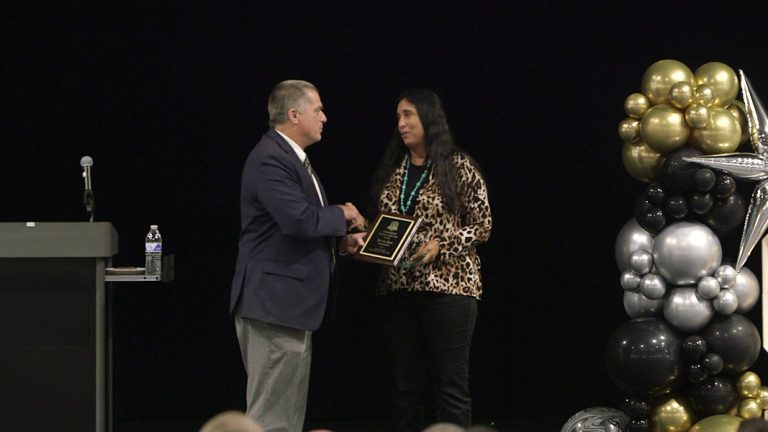 Bus Operator Sylvia Bass receiving the School-Related Employee of the Year Award from Superintendent Tim Forson