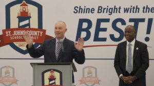 Magnolia Oaks Academy Principal Donny Hoessler speaks at an event celebrating the opening of the new school.